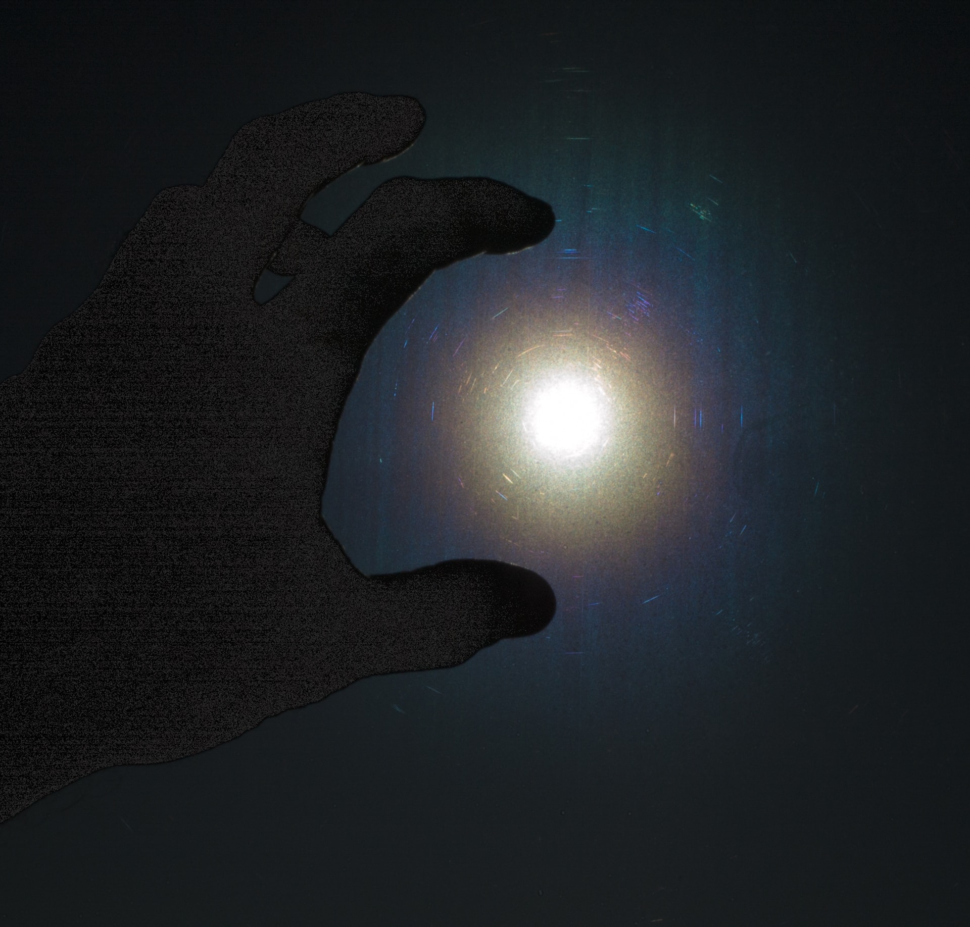 Hand holding a glowing orb of light — squairdok